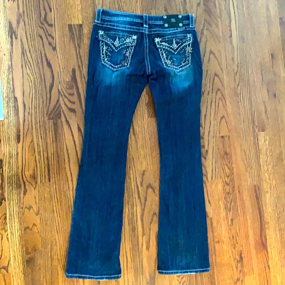 Size 27 waist 33 length Miss Me jeans boot cut.